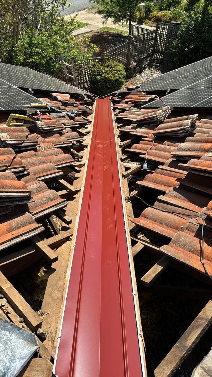 New valley iron in, tiles lifted either side
